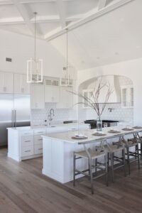 Sleek and modern style all white kitchen with various textures and prints 